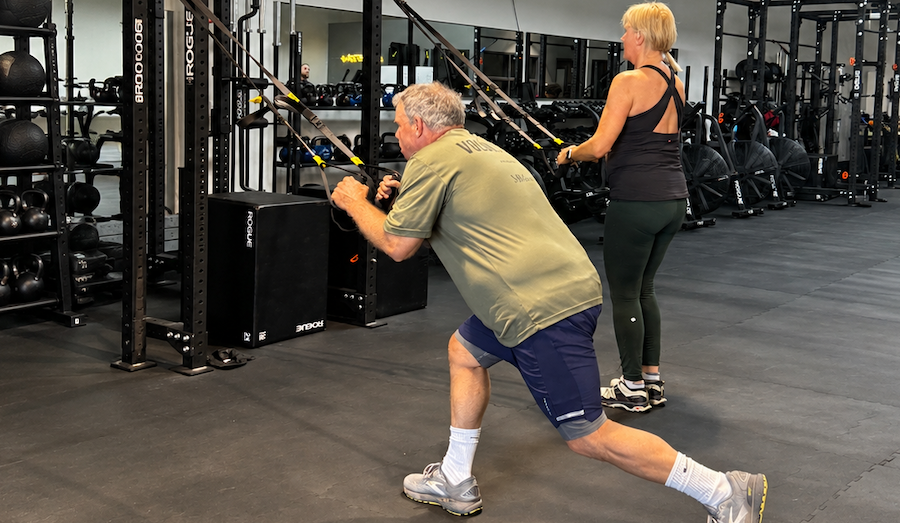 Guest reviewing fitness and body composition progress during a personalized weight loss retreat at Unite.
