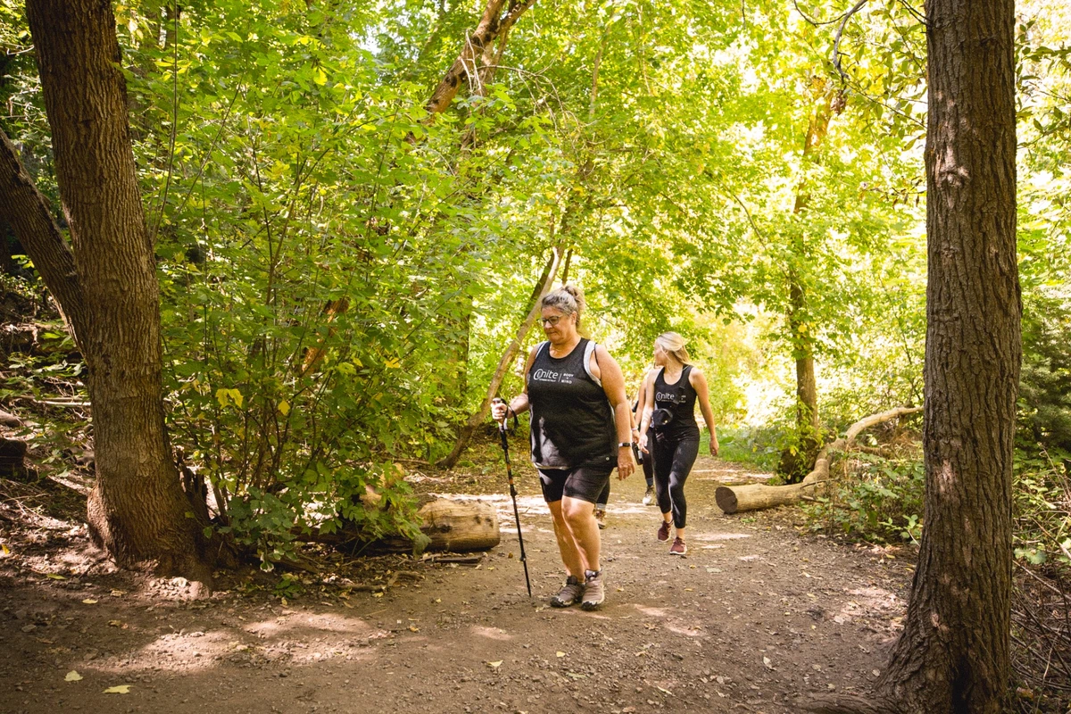 Guests enjoying a guided nature hike at Unite Fitness Retreat in Salt Lake City, Utah.